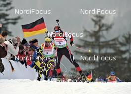 04.03.2012, Ruhpolding, Germany (GER): l-r: Simon Fourcade (FRA), Fischer, Rottefella, Rossignol, Swix, Odlo, Daniel Mesotitsch (AUT), Fischer, Rottefella, Leki - IBU world championships biathlon, pursuit men, Ruhpolding (GER). www.nordicfocus.com. © Felgenhauer/NordicFocus. Every downloaded picture is fee-liable.