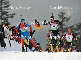 04.03.2012, Ruhpolding, Germany (GER): l-r: Andrei Makoveev (RUS), Fischer, Rottefella, Swix, adidas, Benjamin Weger (SUI), Atomic, Alpina, Leki, Casco, Toko, ODLO - IBU world championships biathlon, pursuit men, Ruhpolding (GER). www.nordicfocus.com. © Felgenhauer/NordicFocus. Every downloaded picture is fee-liable.