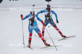 04.03.2012, Ruhpolding, Germany (GER): Olga Vilukhina (RUS), Fischer, Rottefella, Swix, adidas , Svetlana Sleptsova (RUS), Fischer, Rottefella, Alpina, Swix, adidas - IBU world championships biathlon, pursuit women, Ruhpolding (GER). www.nordicfocus.com. © Manzoni/NordicFocus. Every downloaded picture is fee-liable.