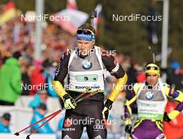 09.03.2012, Ruhpolding, Germany (GER): l-r: Andreas Birnbacher (GER), Fischer, Rottefella, Alpina, Leki, adidas, Simon Fourcade (FRA), Fischer, Rottefella, Rossignol, Swix, Odlo - IBU world championships biathlon, relay men, Ruhpolding (GER). www.nordicfocus.com. © Felgenhauer/NordicFocus. Every downloaded picture is fee-liable.