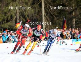 09.03.2012, Ruhpolding, Germany (GER): Ole Einar Bjoerndalen (NOR), Madshus, Rottefella, Odlo, Simon Schempp (GER), Fischer, Rottefella, Alpina, Leki, adidas , Lowell Bailey (USA), Rossignol, Rottefella, One Way - IBU world championships biathlon, relay men, Ruhpolding (GER). www.nordicfocus.com. © Manzoni/NordicFocus. Every downloaded picture is fee-liable.