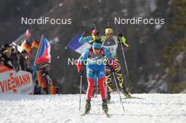 09.03.2012, Ruhpolding, Germany (GER): Andrei Makoveev (RUS), Fischer, Rottefella, Swix, adidas leads Simon Fourcade (FRA), Fischer, Rottefella, Rossignol, Swix, Odlo - IBU world championships biathlon, relay men, Ruhpolding (GER). www.nordicfocus.com. © Manzoni/NordicFocus. Every downloaded picture is fee-liable.