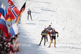 09.03.2012, Ruhpolding, Germany (GER): Simon Schempp (GER), Fischer, Rottefella, Alpina, Leki, adidas  leads Jean Guillaume Beatrix (FRA), Rossignol, Rottefella, One Way, Odlo - IBU world championships biathlon, relay men, Ruhpolding (GER). www.nordicfocus.com. © Manzoni/NordicFocus. Every downloaded picture is fee-liable.