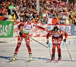10.03.2012, Ruhpolding, Germany (GER): l-r: Elise Ringen (NOR), Fischer, Rottefella, Odlo, Synnoeve Solemdal (NOR), Madshus, Rottefella, Swix, ODLO - IBU world championships biathlon, relay women, Ruhpolding (GER). www.nordicfocus.com. © Felgenhauer/NordicFocus. Every downloaded picture is fee-liable.
