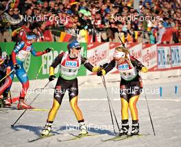 10.03.2012, Ruhpolding, Germany (GER): l-r: Magdalena Neuner (GER), Fischer, Rottefella, Swix, adidas, Toko, Miriam Goessner (GER), Fischer, Salomon, Swix, adidas - IBU world championships biathlon, relay women, Ruhpolding (GER). www.nordicfocus.com. © Felgenhauer/NordicFocus. Every downloaded picture is fee-liable.