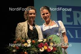 01.03.2012, Ruhpolding, Germany (GER): Selina Gasparin (SUI), Rossignol, Rottefella, Alpina, Leki, ODLO, Kathrin Hitzer (GER), Salomon, Swix, adidas - IBU world championships biathlon, Biathlon Award Ceremony, Ruhpolding (GER). www.nordicfocus.com. © Manzoni/NordicFocus. Every downloaded picture is fee-liable.