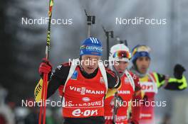 02.12.2012, Oestersund, Sweden (SWE): Andreas Birnbacher (GER), Fischer, Rottefella, Alpina, Leki, adidas, Emil Hegle Svendsen (NOR), Madshus, Rottefella, Swix, Odlo, Martin Fourcade (FRA), Rossignol, Rottefella, OneWay - IBU world cup biathlon, pursuit men, Oestersund (SWE). www.nordicfocus.com. © Manzoni/NordicFocus. Every downloaded picture is fee-liable.