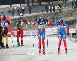 25.11.2012, Oestersund, Sweden (SWE): Alexey Volkov (RUS), Fischer, Rottefella, Swix, adidas, Olga Vilukhina (RUS), Fischer, Rottefella, Alpina, Swix, adidas  - IBU world cup biathlon, relay mixed, Oestersund (SWE). www.nordicfocus.com. © Manzoni/NordicFocus. Every downloaded picture is fee-liable.