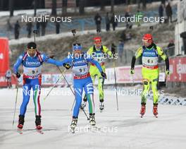 25.11.2012, Oestersund, Sweden (SWE): Christian de Lorenzi (ITA), Atomic, Rottefella, OneWay, Karin Oberhofer (ITA), Fischer, Rottefella, Alpina, Swix, Anastasiya Kuzmina (SVK), Fischer, Salomon, Start, Miroslav Matiasko (SVK), Atomic,  Rottefella, Alpina, Leki - IBU world cup biathlon, relay mixed, Oestersund (SWE). www.nordicfocus.com. © Manzoni/NordicFocus. Every downloaded picture is fee-liable.