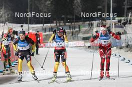 25.11.2012, Oestersund, Sweden (SWE): L-R: Eric Lesser (GER), Salomon, Swix, adidas, Andrea Henkel (GER), Fischer, Rottefella, Swix, adidas, Toko, Erlend Bjoentegaard (NOR), Madshus, Rottefella, Swix - IBU world cup biathlon, relay mixed, Oestersund (SWE). www.nordicfocus.com. © Manzoni/NordicFocus. Every downloaded picture is fee-liable.