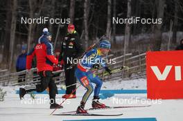 01.12.2012, Oestersund, Sweden (SWE): Magnus Jonsson (SWE), Madshus, Rottefella, Leki, adidas getting a pole by an america technician - IBU world cup biathlon, sprint men, Oestersund (SWE). www.nordicfocus.com. © Manzoni/NordicFocus. Every downloaded picture is fee-liable.