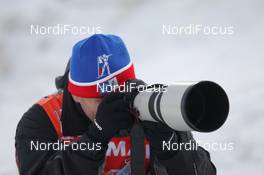 01.12.2012, Oestersund, Sweden (SWE): Evgeny Tumasov (RUS), russian photographer - IBU world cup biathlon, sprint men, Oestersund (SWE). www.nordicfocus.com. © Manzoni/NordicFocus. Every downloaded picture is fee-liable.