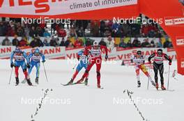 04.01.2012, Cortina-Toblach, Italy (ITA): finish, l-r: Nikolay Morilov (RUS), Madshus, Rottefella, adidas, Swix, Petter Northug (NOR), Fischer, Rottefella, Alpina, Ski Go, Swix, Dario Cologna (SUI), Fischer, Rottefella, Alpina, Swix, Odlo  - FIS world cup cross-country, tour de ski, individual sprint, Cortina-Toblach (ITA). www.nordicfocus.com. © Hemmersbach/NordicFocus. Every downloaded picture is fee-liable.