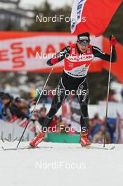 08.01.2012, Val di Fiemme, Italy (ITA): Tour Overall Winner Dario Cologna (SUI), Fischer, Rottefella, Alpina, Swix, Odlo  - FIS world cup cross-country, tour de ski, final climb men, Val di Fiemme (ITA). www.nordicfocus.com. © Hemmersbach/NordicFocus. Every downloaded picture is fee-liable.