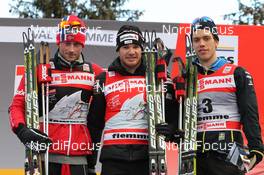 08.01.2012, Val di Fiemme, Italy (ITA): overall podium, l-r: 3rd Petter Northug (NOR), Fischer, Rottefella, Alpina, Ski Go, Swix, 1st Dario Cologna (SUI), Fischer, Rottefella, Alpina, Swix, Odlo, 2nd Marcus Hellner (SWE), Fischer, Salomon, Exel, Craft  - FIS world cup cross-country, tour de ski, final climb men, Val di Fiemme (ITA). www.nordicfocus.com. © Hemmersbach/NordicFocus. Every downloaded picture is fee-liable.