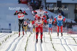 07.01.2012, Val di Fiemme, Italy (ITA): finish, l-r: Dario Cologna (SUI), Fischer, Rottefella, Alpina, Swix, Odlo, Eldar Roenning (NOR), Rossignol, Rottefella, Swix, behind him Alex Harvey (CAN), Fischer, Salomon, Swix, One Way, Sergey Turychev (RUS), Madshus, Rottefella, Swix, Adidas  - FIS world cup cross-country, tour de ski, mass men, Val di Fiemme (ITA). www.nordicfocus.com. © Hemmersbach/NordicFocus. Every downloaded picture is fee-liable.