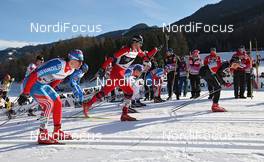 07.01.2012, Val di Fiemme, Italy (ITA): in front Dario Cologna (SUI), Fischer, Rottefella, Alpina, Swix, Odlo, behind in the center Petter Northug (NOR), Fischer, Rottefella, Alpina, Ski Go, Swix  and on the left Maxim Vylegzhanin (RUS), Fischer, Rottefella, Alpina, Swix, adidas  - FIS world cup cross-country, tour de ski, mass men, Val di Fiemme (ITA). www.nordicfocus.com. © Hemmersbach/NordicFocus. Every downloaded picture is fee-liable.