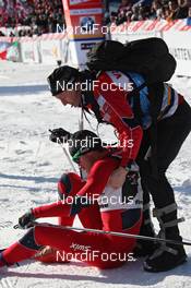 07.01.2012, Val di Fiemme, Italy (ITA): Petter Northug (NOR), Fischer, Rottefella, Alpina, Ski Go, Swix  exhausted in the finish area - FIS world cup cross-country, tour de ski, mass men, Val di Fiemme (ITA). www.nordicfocus.com. © Hemmersbach/NordicFocus. Every downloaded picture is fee-liable.