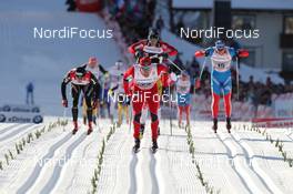 07.01.2012, Val di Fiemme, Italy (ITA): the finish, l-r: Dario Cologna (SUI), Fischer, Rottefella, Alpina, Swix, Odlo, Eldar Roenning (NOR), Rossignol, Rottefella, Swix, Sergey Turychev (RUS), Madshus, Rottefella, Swix, Adidas  - FIS world cup cross-country, tour de ski, mass men, Val di Fiemme (ITA). www.nordicfocus.com. © Hemmersbach/NordicFocus. Every downloaded picture is fee-liable.
