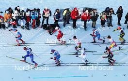 07.01.2012, Val di Fiemme, Italy (ITA): helicopter view, in front l-r: Lukas Bauer (CZE), Fischer, Rottefella, Alpina, Swix, Toko, Maxim Vylegzhanin (RUS), Fischer, Rottefella, Alpina, Swix, adidas, behind Alexander Legkov (RUS), Rossignol, Rottefella, Swix, adidas and Petter Northug (NOR), Fischer, Rottefella, Alpina, Ski Go, Swix, also visible Alex Harvey (CAN), Fischer, Salomon, Swix, One Way and Devon Kershaw (CAN), Fischer, Salomon, Swix, One Way    - FIS world cup cross-country, tour de ski, mass men, Val di Fiemme (ITA). www.nordicfocus.com. © Hemmersbach/NordicFocus. Every downloaded picture is fee-liable.