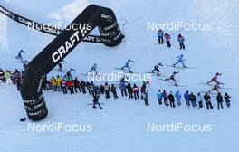 07.01.2012, Val di Fiemme, Italy (ITA): helicopter view, passing the Craft arc - FIS world cup cross-country, tour de ski, mass men, Val di Fiemme (ITA). www.nordicfocus.com. © Hemmersbach/NordicFocus. Every downloaded picture is fee-liable.
