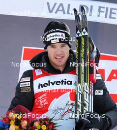 07.01.2012, Val di Fiemme, Italy (ITA): current Tour Leader and Sprint Leader Dario Cologna (SUI), Fischer, Rottefella, Alpina, Swix, Odlo  - FIS world cup cross-country, tour de ski, mass men, Val di Fiemme (ITA). www.nordicfocus.com. © Hemmersbach/NordicFocus. Every downloaded picture is fee-liable.