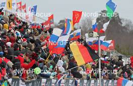 05.02.2012, Rybinsk, Russia (RUS): spectators and flags - FIS world cup cross-country, skiathlon men, Rybinsk (RUS). www.nordicfocus.com. © Hemmersbach/NordicFocus. Every downloaded picture is fee-liable.