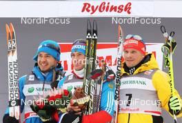 05.02.2012, Rybinsk, Russia (RUS): podium, l-r: Ilia Chernousov (RUS), Rossignol, Rottefella, Swix, adidas, Maxim Vylegzhanin (RUS), Fischer, Rottefella, Alpina, Swix, adidas, Tobias Angerer (GER), Rossignol, Rottefella, One Way, adidas  - FIS world cup cross-country, skiathlon men, Rybinsk (RUS). www.nordicfocus.com. © Hemmersbach/NordicFocus. Every downloaded picture is fee-liable.