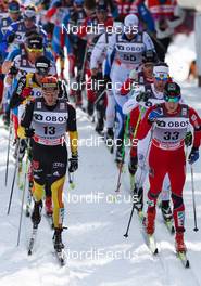 10.03.2012, Oslo, Norway (NOR): (l-r) Jens Filbrich (GER), Rossignol, One Way, Rottefella, Adidas and Petter Eliassen (NOR), Fischer, Swix, Alpina, Rottefella  - FIS world cup cross-country, mass men, Oslo (NOR). www.nordicfocus.com. Â© Laiho/NordicFocus. Every downloaded picture is fee-liable.