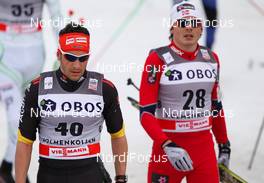 10.03.2012, Oslo, Norway (NOR):  (l-r) Hanner Dotzler (GER), Fischer, Swix, Alpina, Rottefella, Adidas and Finn Hagen Krogh (NOR), Fischer, Swix, Alpina, Rottefella - FIS world cup cross-country, mass men, Oslo (NOR). www.nordicfocus.com. Â© Laiho/NordicFocus. Every downloaded picture is fee-liable.