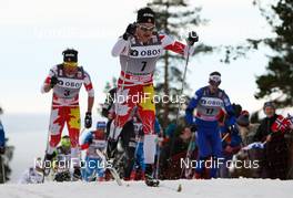 10.03.2012, Oslo, Norway (NOR):  Alex Harvey (CAN), Fischer, Swix, Salomon, One Way followed by Devon Kershaw (CAN), Fischer, Swix, Salomon, One Way - FIS world cup cross-country, mass men, Oslo (NOR). www.nordicfocus.com. Â© Laiho/NordicFocus. Every downloaded picture is fee-liable.