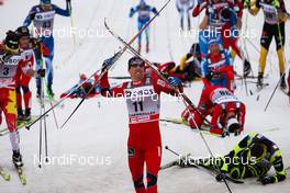 10.03.2012, Oslo, Norway (NOR):  Eldar Roenning (NOR), Rorrignol, Swix, Rottefella and tired men in the finish - FIS world cup cross-country, mass men, Oslo (NOR). www.nordicfocus.com. Â© Laiho/NordicFocus. Every downloaded picture is fee-liable.