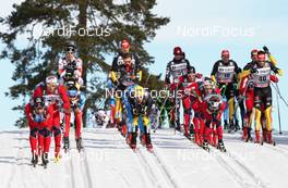 10.03.2012, Oslo, Norway (NOR): downhill, l-r: Eldar Roenning (NOR), Rossignol, Rottefella, Swix, Simen Oestensen (NOR), Atomic, Swix, Hannes Dotzler (GER), Fischer, Rottefella, Alpina, Swix, Adidas  - FIS world cup cross-country, mass men, Oslo (NOR). www.nordicfocus.com. © Hemmersbach/NordicFocus. Every downloaded picture is fee-liable.