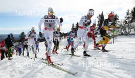 10.03.2012, Oslo, Norway (NOR): (r-l) Tobias Angerer (GER), Rossignol, One Way, Rottefella, Adidas, Marcus Hellner (SWE), Fischer, Swix, Salomon, Craft, Johan Olsson (SWE), Fischer, Swix, Alpina, Rottefella, Craft and Daniel Rickardsson (SWE), Fischer, One Way, Rottefella, Craft  - FIS world cup cross-country, mass men, Oslo (NOR). www.nordicfocus.com. Â© Laiho/NordicFocus. Every downloaded picture is fee-liable.