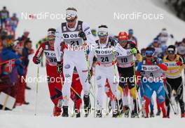 10.03.2012, Oslo, Norway (NOR): Daniel Rickardsson (SWE), Fischer, One Way, Rottefella, Craft followed by Anders Soedergren (SWE), Fischer, One Way, Salomon, Craft and Tobias Angerer (GER), Rossignol, One Way, Rottefella, Adidas  - FIS world cup cross-country, mass men, Oslo (NOR). www.nordicfocus.com. Â© Laiho/NordicFocus. Every downloaded picture is fee-liable.