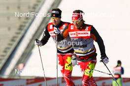 11.03.2012, Oslo, Norway (NOR):  (r-l) Devon Kershaw (CAN), Fischer, Swix, Salomon, One Way and Alex Harvey (CAN), Fischer, Swix, Salomon, One Way - FIS world cup cross-country, 30km mass women, Oslo (NOR). www.nordicfocus.com.Â© Laiho/NordicFocus. Every downloaded picture is fee-liable.