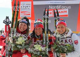 11.03.2012, Oslo, Norway (NOR): Justyna Kowalczyk (POL), Fischer, Rottefella, Swix, Marit Bjoergen (NOR), Fischer, Rottefella, Swix, Therese Johaug (NOR), Fischer, Salomon, Swix  - FIS world cup cross-country, mass women, Oslo (NOR). www.nordicfocus.com. © Hemmersbach/NordicFocus. Every downloaded picture is fee-liable.