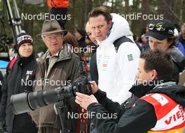 17.03.2012, Falun, Sweden (SWE): l-r: Carl XVI. Gustaf (SWE), King of Sweden, Mats Arjes (SWE), President of the Swedish Ski Federation, Sarah Lewis (GBR) FIS secretary general talking with a photographer - FIS world cup cross-country, mass women, Falun (SWE). www.nordicfocus.com. © Hemmersbach/NordicFocus. Every downloaded picture is fee-liable.