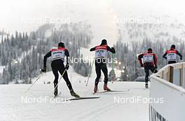 23.11.2012, Gaellivare, Sweden (SWE): Team Switzerland with (l-r): Dario Cologna (SUI) and Remo Fischer (SUI) enters Gaellivare ski stadium - FIS world cup cross-country, training, Gaellivare (SWE). www.nordicfocus.com. © Felgenhauer/NordicFocus. Every downloaded picture is fee-liable.