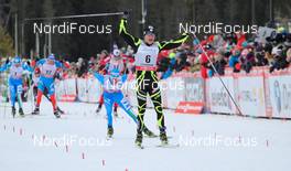 16.12.2012, Canmore, Canada (CAN):  Maurice Manificat (FRA), Fischer, Swix, Rottefella, One Way followed by Roland Clara (ITA), Fischer, Swix, Rottefella - FIS world cup cross-country, skiathlon men, Canmore (CAN). www.nordicfocus.com. © Roycroft/NordicFocus. Every downloaded picture is fee-liable.