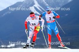 16.12.2012, Canmore, Canada (CAN):  Ivan Babikov (CAN), Salomon, One Way in front of Evgeniy Belov (RUS), Fischer, Swix, Alpina, Rottefella, Adidas - FIS world cup cross-country, skiathlon men, Canmore (CAN). www.nordicfocus.com. © Roycroft/NordicFocus. Every downloaded picture is fee-liable.