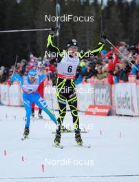 16.12.2012, Canmore, Canada (CAN):  Maurice Manificat (FRA), Fischer, Swix, Rottefella, One Way followed by Roland Clara (ITA), Fischer, Swix, Rottefella - FIS world cup cross-country, skiathlon men, Canmore (CAN). www.nordicfocus.com. © Roycroft/NordicFocus. Every downloaded picture is fee-liable.
