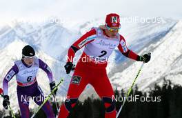 16.12.2012, Canmore, Canada (CAN):  Vibeke Skofterud (NOR), Fischer, One Way, Alpina, Rottefella, Yoko followed by Masako Ishida (JPN), Salomon, Swix - FIS world cup cross-country, skiathlon women, Canmore (CAN). www.nordicfocus.com. © Roycroft/NordicFocus. Every downloaded picture is fee-liable.