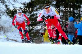 16.12.2012, Canmore, Canada (CAN):  Justyna Kowalczyk (POL), Fischer, Swix, Rottefella followed by Kristin Steira (NOR), Madshus, One Way, Salomon, Swix - FIS world cup cross-country, skiathlon women, Canmore (CAN). www.nordicfocus.com. © Roycroft/NordicFocus. Every downloaded picture is fee-liable.