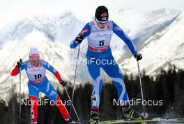 16.12.2012, Canmore, Canada (CAN): Anne Kylloenen (FIN), Fischer, Swix, Rottefella, Craft followed by  Alina Iksanova (RUS), Fischer, Swix, Salomon, Adidas - FIS world cup cross-country, skiathlon women, Canmore (CAN). www.nordicfocus.com. © Roycroft/NordicFocus. Every downloaded picture is fee-liable.