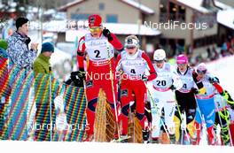 16.12.2012, Canmore, Canada (CAN): Vibeke Skofterud (NOR), Fischer, One Way, Alpina, Rottefella, Yoko followed by Kristin Steira (NOR), Madshus, One Way, Salomon, Swix and Anna Haag (SWE), Fischer, One Way, Rottefella, Craft  - FIS world cup cross-country, skiathlon women, Canmore (CAN). www.nordicfocus.com. © Roycroft/NordicFocus. Every downloaded picture is fee-liable.