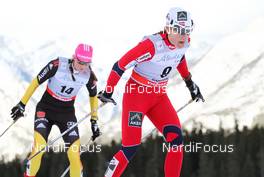 16.12.2012, Canmore, Canada (CAN):  Maiken Caspersen Falla (NOR), Fischer, Swix, Alpina, Rottefella followed by Denise Hermann (GER), Fischer, Swix, Apina, Rottefella, Adidas - FIS world cup cross-country, skiathlon women, Canmore (CAN). www.nordicfocus.com. © Roycroft/NordicFocus. Every downloaded picture is fee-liable.