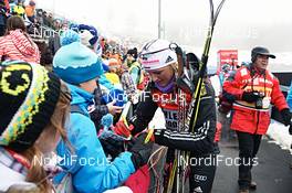29.12.2012, Oberhof, Germany (GER): Denise Herrmann (GER) writing autographs - FIS world cup cross-country, tour de ski, prologue women, Oberhof (GER). www.nordicfocus.com. © Felgenhauer/NordicFocus. Every downloaded picture is fee-liable.
