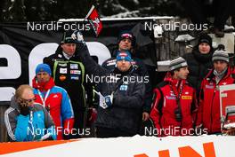 07.03.2012, Trondheim, Norway (NOR): the head coach of team Finland, Pekka Niemelae (FIN) raises the flag  - FIS world cup ski jumping, training HS131, Trondheim (NOR). www.nordicfocus.com. Â© Laiho/NordicFocus. Every downloaded picture is fee-liable.