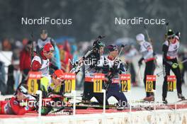 12.01.2013, Ruhpolding, Germany (GER): Claudio Boeckli (SUI), Rossignol, Rottefella, Leki, ODLO, Jay Hakkinen (USA), Rossignol, Rottefella, Swix, adidas - IBU world cup biathlon, sprint men, Ruhpolding (GER). www.nordicfocus.com. © Manzoni/NordicFocus. Every downloaded picture is fee-liable.